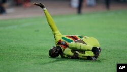 Zimbabwe's Ishmael Wadi gestures following an injury during the African Cup of Nations 2022 group B soccer match between Malawi and Zimbabwe at the Omnisport Stadium in Bafoussam, Cameroon, Friday, Jan. 14, 2022. (AP Photo/Sunday Alamba)