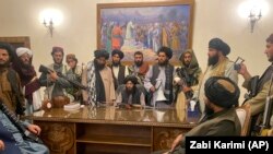 Taliban fighters take control of the Afghan presidential palace in Kabul on August 15, 2021, after Afghan President Ashraf Ghani fled the country. (Zabi Karimi/AP)