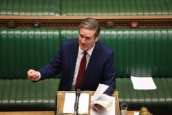 FILE - Britain's Labor Party leader Keir Starmer speaks during a parliament session, in London, Britain, May 11, 2020.