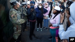 Protesters encounter the Minnesota National Guard, May 29, 2020, in Minneapolis. 