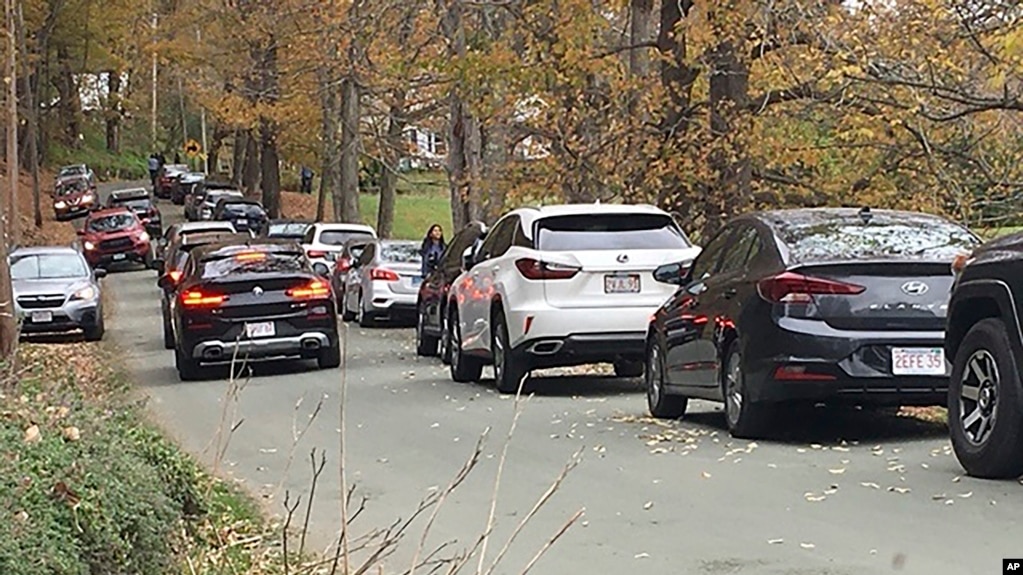 Cars line a narrow road outside a private property in an undated photo, in Pomfret, Vt., that has become a destination for fall foliage viewers, clogging the rural road. (AP Photo)