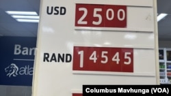 A retail shop in Harare, Zimbabwe, displays the new exchange rate of 25 ZiG to 1 U.S. dollar, it's lowest value since the currency was introduced in April.