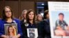 FILE - People hold photos of their children during a Senate Judiciary Committee hearing on online safety for children Feb. 14, 2023, in Washington. Studies have found women experience more online abuse, and harassment is driving girls to quit social media platforms.