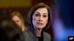 FILE - Iowa Governor Kim Reynolds, a Republican, speaks during a news conference at the Statehouse in Des Moines, Iowa, Jan. 31, 2024.