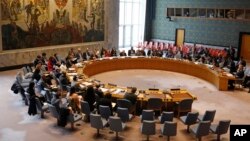 FILE - Members of the U.N. Security Council gather inside the United Nations Security Council chambers in New York, for a meeting on Syria, April 30, 2019.