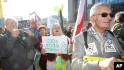 'Good Food Marchers' stage a protest in front of the European Commission headquarters in Brussels, Wednesday, Sept. 19, 2012. Farmers and activists from all over the continent are converging on the E.U.to push for a food policy kinder to the environment and developing nations.