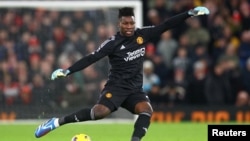 Cameroonian goalkeeper Andre Onana in action for his football club Manchester United against Aston Villa, Old Trafford, Manchester, December 26, 2023.