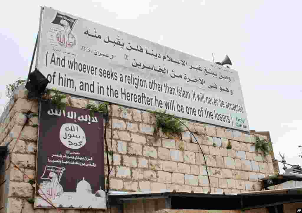 Jama’at Ansar Allah banner displayed at the Shihab e-Din shrine, next to the Basilica of the Annunciation. (VOA - M. Lipin)