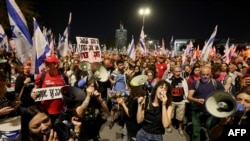 Demonstrators shout slogans during a protest against the Israeli government and to demand a secure release of hostages held by Hamas in the Gaza Strip since the October 7 attacks, in Jerusalem on March 31, 2024.