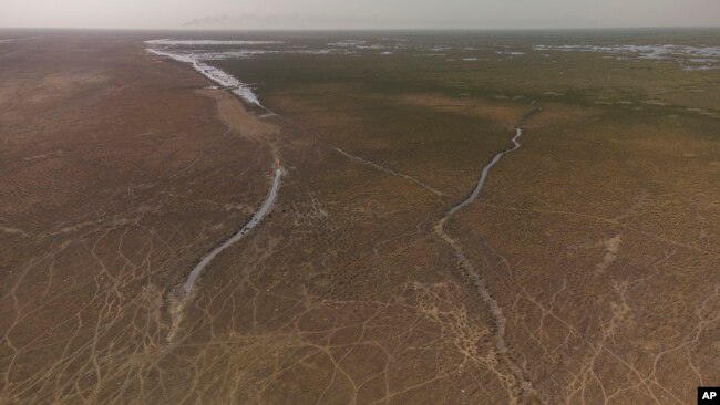 This aerial photo shows a general view of the Chibaish marshes during low water levels in Nasiriyah of southern Iraq on June 16, 2022. (AP Photo/ Nabil al-Jurani)