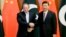 Pakistani Prime Minister Nawaz Sharif, left, shakes hands with Chinese President Xi Jinping ahead of the Belt and Road Forum in Beijing, China, May 13, 2017. 