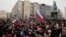 Protesters gather during a rally at Pushkin square in Moscow, Sunday, Jan. 28, 2018. Opposition politician Alexey Navalny calls for nationwide protests following Russia's Central Election Commission's decision to ban his presidential candidacy. 