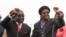 FILE - Zimbabwean President Robert Mugabe and his wife Grace wave to supporters and guests during celebrations to mark his 90th birthday in Marondera about 80km (50 miles) east of the capital Harare, Feb. 23, 2014. Mugabe turned 90 on February 21. RE