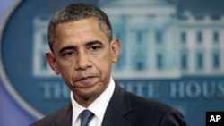 President Barack Obama discusses the continuing budget talks in the briefing room of the White House in Washington, July 19, 2011