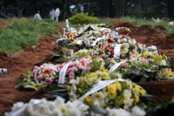 Flowers are lined up at Vila Formosa cemetery, amid the coronavirus outbreak in Sao Paulo, Brazil, March 9, 2021.
