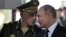  ရုရှားကာကွယ်ရေးဝန်ကြီး Sergei Shoigu (ဝဲ) နဲ့ လတ်တလော ပြန်လည်ရွေးကောက်ခံရသူ ရုရှားသမ္မ  Putin (ယာ)  