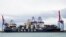 The CMA CGM Symi is seen at port in Valencia, Spain, on Oct. 22, 2023. The container ship, owned by an Israeli billionaire, came under attack by a suspected Iranian drone in the Indian Ocean, a U.S. defense official said on Nov. 25. (Manuel Hernandez Lafuente via AP)