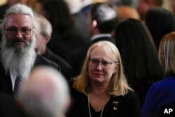 FILE - Amy Carter and her husband John Joseph "Jay" Kelly walk after a tribute service for former first lady Rosalynn Carter at at Emory University on November 28, 2023, in Atlanta.