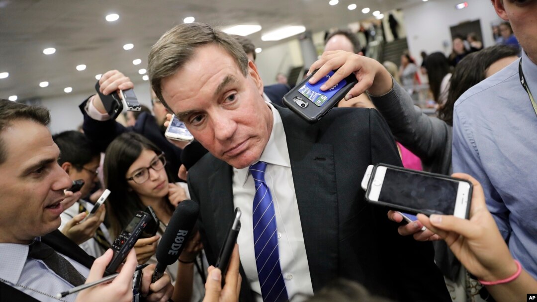 FILE - Senate Intelligence Committee Vice Chairman Mark Warner, D-Virginia, whose panel is investigating Russian interference in the 2016 election, speaks with reporters at the Capitol in Washington, June 22, 2017.