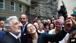 Placido Domingo poses for selfies at the 'Festspielhaus' opera house after he performed 'Luisa Miller' by Giuseppe Verdi in Salzburg, Austria, Sunday, Aug. 25, 2019. 