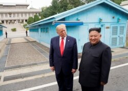 FILE - U.S. President Donald Trump meets with North Korean leader Kim Jong Un at the demilitarized zone separating the two Koreas, in Panmunjom, South Korea, June 30, 2019.