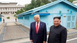 FILE - U.S. President Donald Trump meets with North Korean leader Kim Jong Un at the demilitarized zone separating the two Koreas, in Panmunjom, South Korea, June 30, 2019.