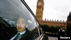 FILE - Mark Sedwill leaves the Houses of Parliament in London, July 8, 2014.