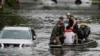 Rescuers evacuate people from an apartment complex in Clearwater, Florida, on Oct. 10, 2024, after Hurricane Milton hit. Misinformation and conspiracy theories about the government's response to this storm and Hurricane Helene endanger residents and first responders, experts say.