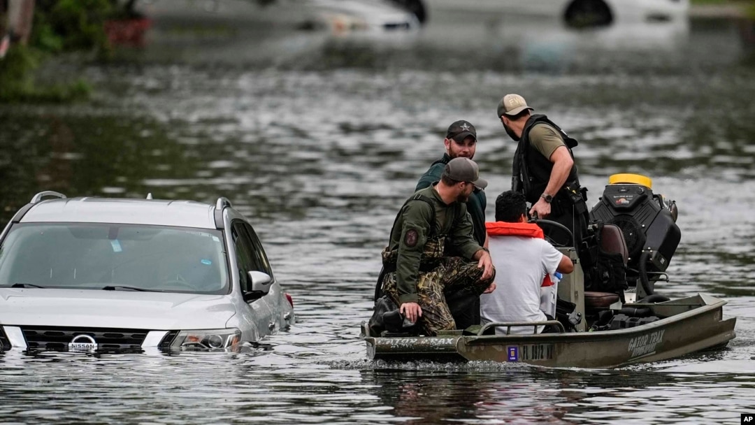 Rescuers evacuate people from an apartment complex in Clearwater, Florida, on Oct. 10, 2024, after Hurricane Milton hit. Misinformation and conspiracy theories about the government's response to this storm and Hurricane Helene endanger residents and first responders, experts say.