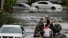 Rescuers evacuate people from an apartment complex in Clearwater, Florida, in the aftermath of Hurricane Milton on Oct. 10, 2024.