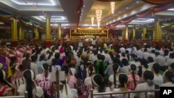 Myanmar Buddhist including monks and nuns attend the 4th anniversary of the nationwide gathering at a monastery, Saturday, May 27, 2017, in Yangon.