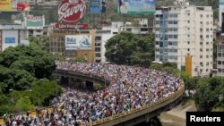 Demonstrators rally during the so-called "mother of all marches" against Venezuela's President Nicolas Maduro in Caracas, Venezuela April 19, 2017.