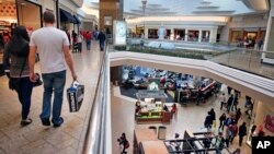 Shoppers troll for sales at Cherry Creek Mall, in Denver, Colorado, Nov. 29, 2013.