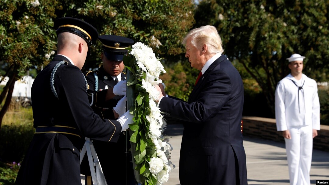 U.S. President Donald Trump lays a wreath during the 9/11 observance at the National 9/11 Pentagon Memorial in Arlington, Virginia, Sept. 11, 2017. 
