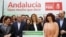 Andalusia's regional government acting president Susana Diaz (C) smiles as she gives a news conference with party members in the Andalusian capital of Seville, Spain, March 23, 2015. 
