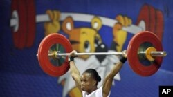 Nigeria's Augustina Nwaokolo wins a Gold medal in the women's weightlifting event at the Commonwealth Games in New Delhi, India, 4 Oct. 2010