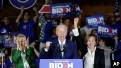 Democratic presidential candidate former Vice President Joe Biden speaks at a primary election night campaign rally, March 3, 2020, in Los Angeles with his wife Jill Biden, left, and his sister Valerie. 