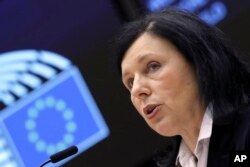 FILE - European Commissioner for Values and Transparency Vera Jourova at the EUParliament in Brussels, March 25, 2021. The EU is pushing online platforms to fight against false information by by labeling text, photoes and other content generated by AI, she says.