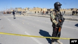 Security personnel inspect the site of a bomb blast in Quetta, Pakistan, on Feb. 1, 2024. On Feb. 2 in Mach, about 65 kilometers (40 miles) southeast of Quetta, government security forces killed 24 separatist militants in a counterinsurgency operation.