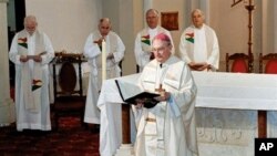 An undated photo obtained on May 2, 2011 shows William Morris (foreground), who has been the Catholic Bishop of the vast Queensland diocese of Toowoomba since 1993.