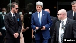 U.S. Secretary of State John Kerry leaves a meeting at a hotel in Vienna, Austria, July 14, 2014.