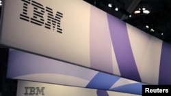 FILE - The IBM logo is seen at the SIBOS banking and financial conference in Toronto, Ontario, Canada, Oct. 19, 2017. 