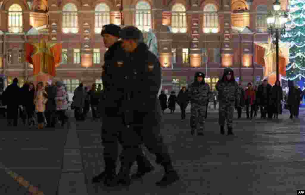 Russian police patrol on Manezhnaya square outside the Kremlin in Moscow, Thursday, Dec. 8, 2011. Moscow has already put about 50,000 police and 2,000 paramilitary troops on the streets, backed by water cannon. Prime Minister Vladimir Putin warned that th