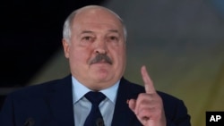 FILE - Belarusian President Alexander Lukashenko gestures while speaking in St. Petersburg, Russia, on Jan. 27, 2024. A new U.N. report released March 20, 2024, says evidence could show Lukashenko's government committed "the crime against humanity of persecution."