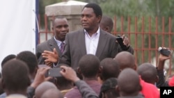 FILE - Then-Presidential candidate Hakainde Hichilema addresses supporters in Lusaka, Zambia, Jan, 21, 2015.