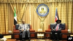 FILE - Gen. Abdel-Fattah Burhan, left, head of Sudan’s Sovereign Council, meets with South Sudan’s President Salva Kiir, in Juba, South Sudan, Oct. 14, 2019. The council has ordered the closure of Sudan's borders with Libya and Central African Republic.