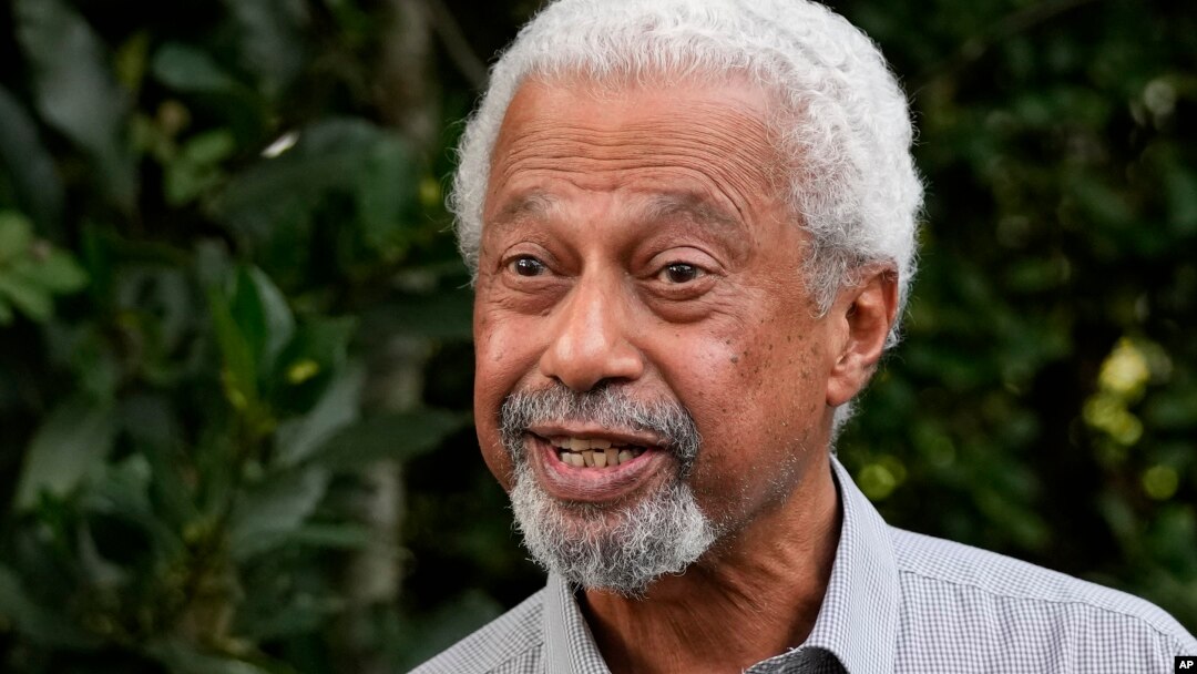 Tanzanian writer Abdulrazak Gurnah gestures as he poses for a photo at his home in Canterbury, England, Oct. 7, 2021.