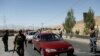 FILEL - Afghan security forces keep watch at a checkpoint on the Ghazni highway in Maidan Shar, the capital of Wardak province, Aug. 12, 2018. The Swedish Committed for Afghanistan condemned, July 11, 2019, an attack on one of its clinics in the province.