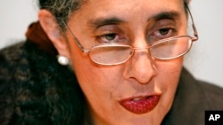 FILE - Harvard law professor Lani Guinier speaks to reporters before her remarks at the Martin Luther King Jr. Memorial Breakfast in Boston, on Jan. 17, 2005. 