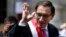 Peru's President Martin Vizcarra waves as he makes his way to the House of Pizarro, the presidential residence and workplace, in Lima, Peru, March 23, 2018. Vizcarra was sworn in, taking over from his predecessor, Pedro Pablo Kuczynski, who resigned over corruption allegations.